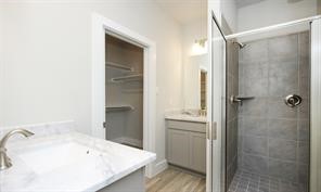 1905 Lonestar Brook Lane Houston, TX 77080 - Photo 20 of 23 a bathroom with a tub sink and vanity