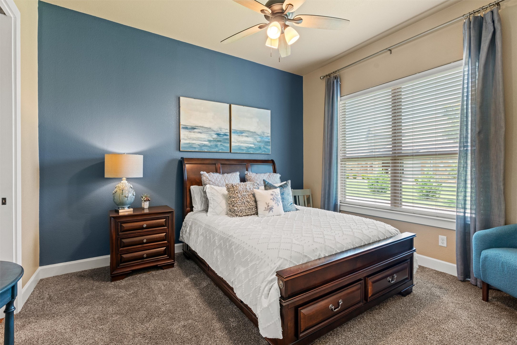 104 Adobe Cove Georgetown, TX 78633 - Photo 20 of 40 Relax in a comfortable bedroom featuring plush carpeting and a convenient ceiling fan.