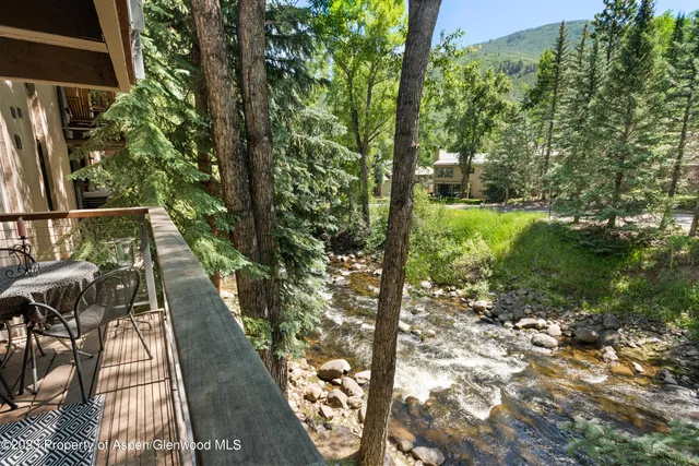 a view of balcony with yard