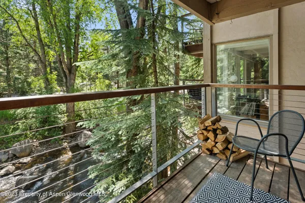 a view of a balcony with chairs