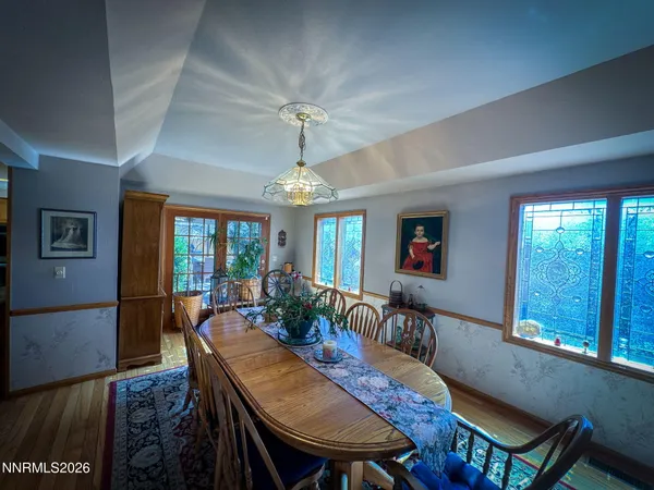 a view of a dining room with furniture window and outside view