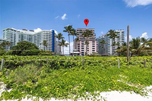 a view of outdoor space with a car parked in the background