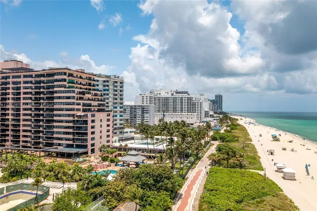 an aerial view of a house with a swimming pool