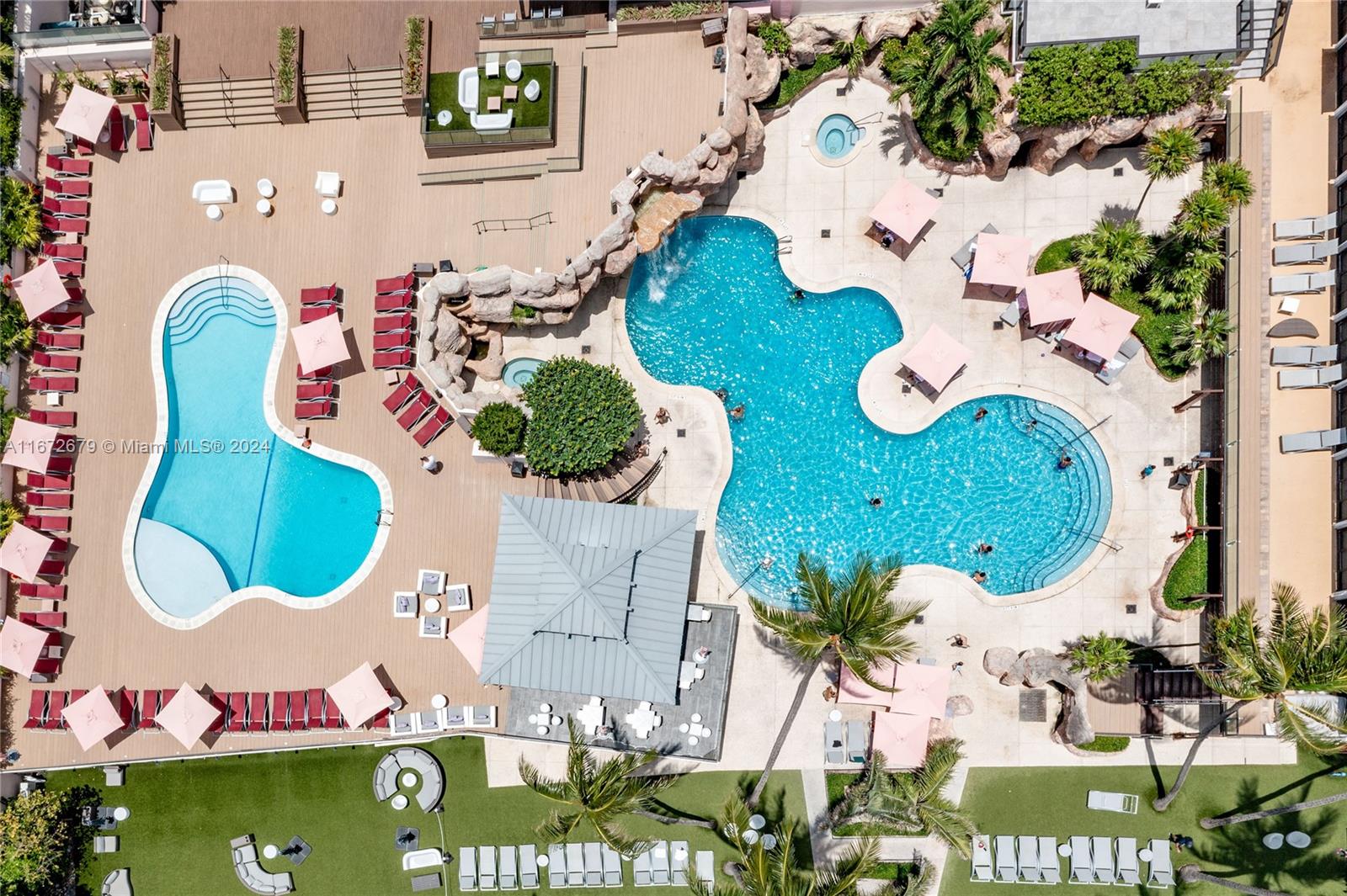 5225 Collins Avenue, Unit 1114 Miami Beach, FL 33140 - Photo 40 of 49 an aerial view of a house with a swimming pool
