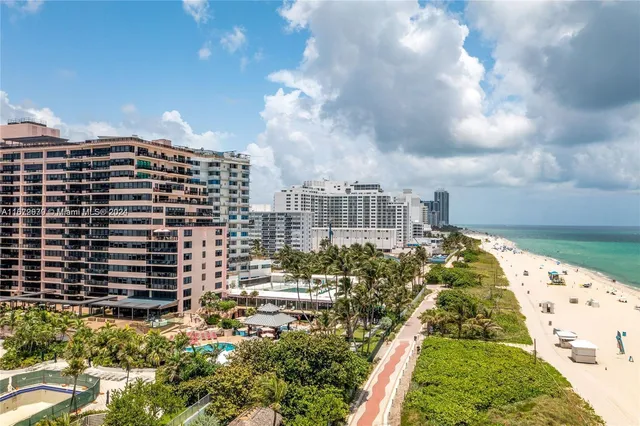 an aerial view of a house with a swimming pool