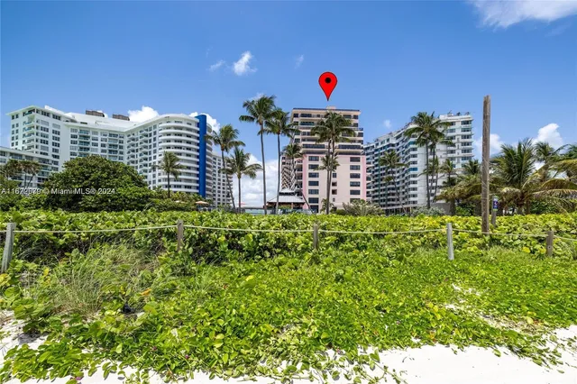 a view of a swimming pool with sitting area