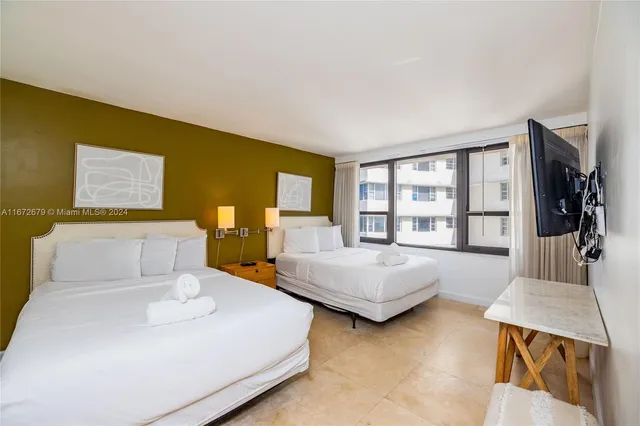 a bedroom with bed and window