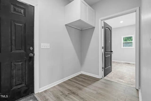 a view of a livingroom with a chandelier fan