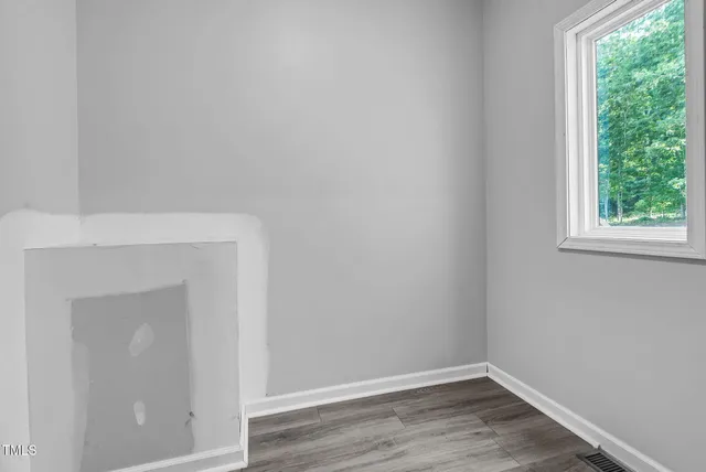 a white bath tub sitting in a bathroom