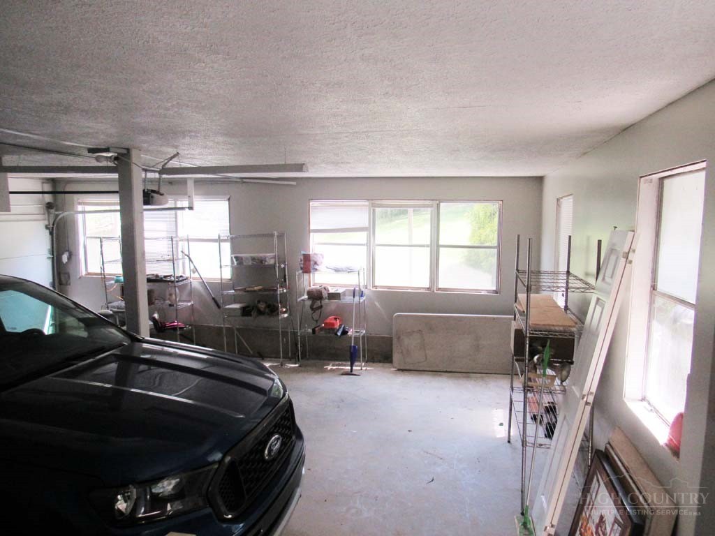 805 Ed Little Road Warrensville, NC 28693 - Photo 48 of 49 a room with furniture and a window