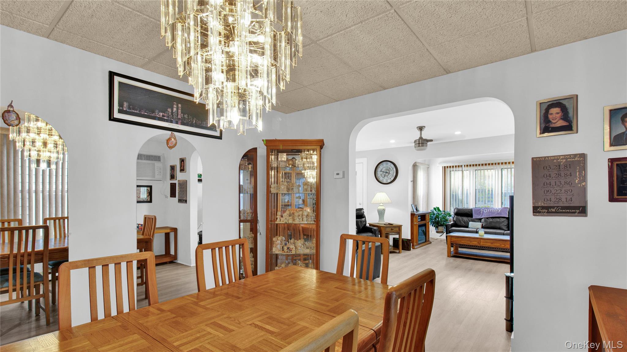 56 Liggett Road Valley Stream, NY 11581 - Photo 11 of 29 a living room with furniture kitchen view and a large window