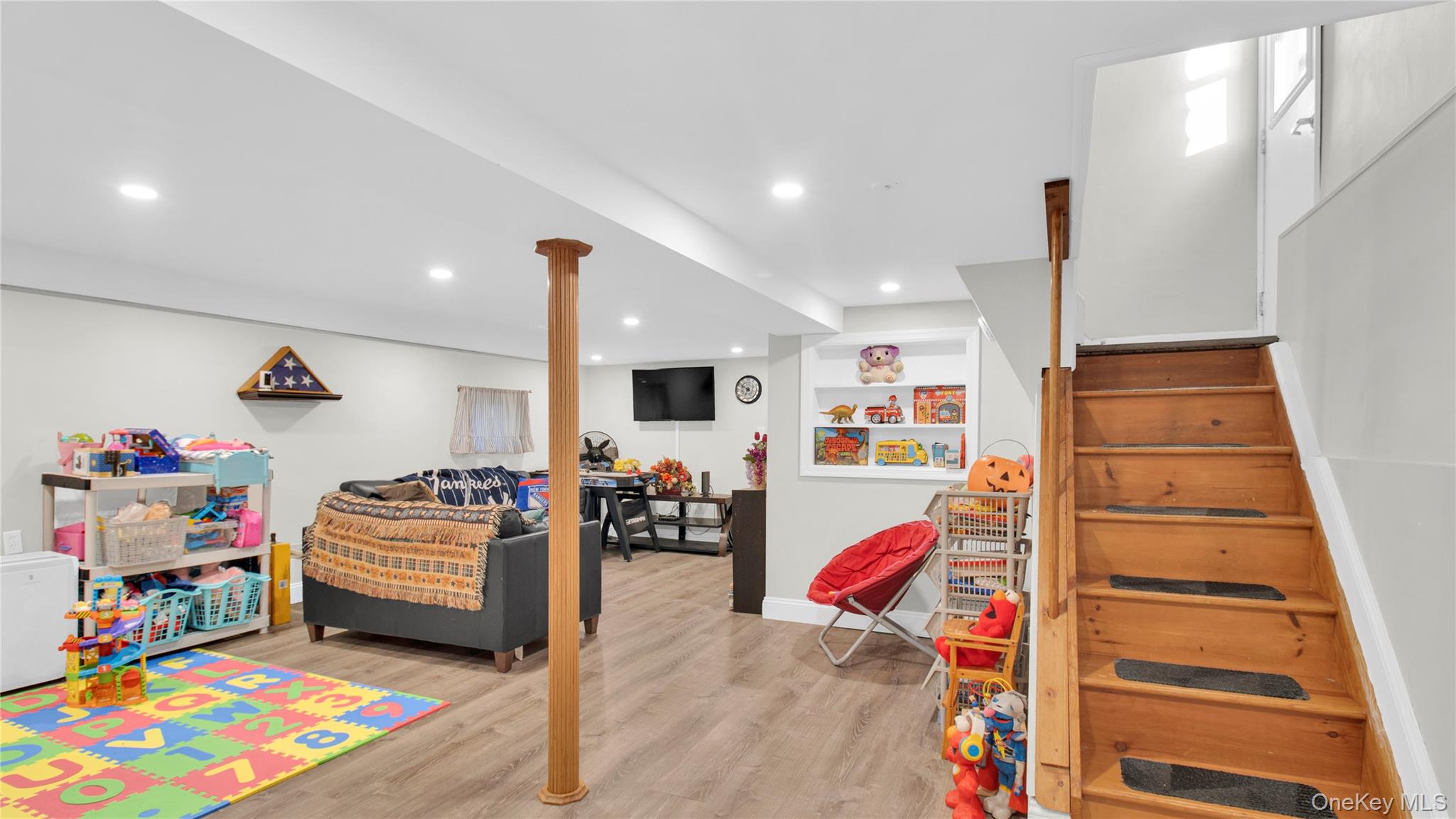56 Liggett Road Valley Stream, NY 11581 - Photo 20 of 29 a living room with furniture and a couch