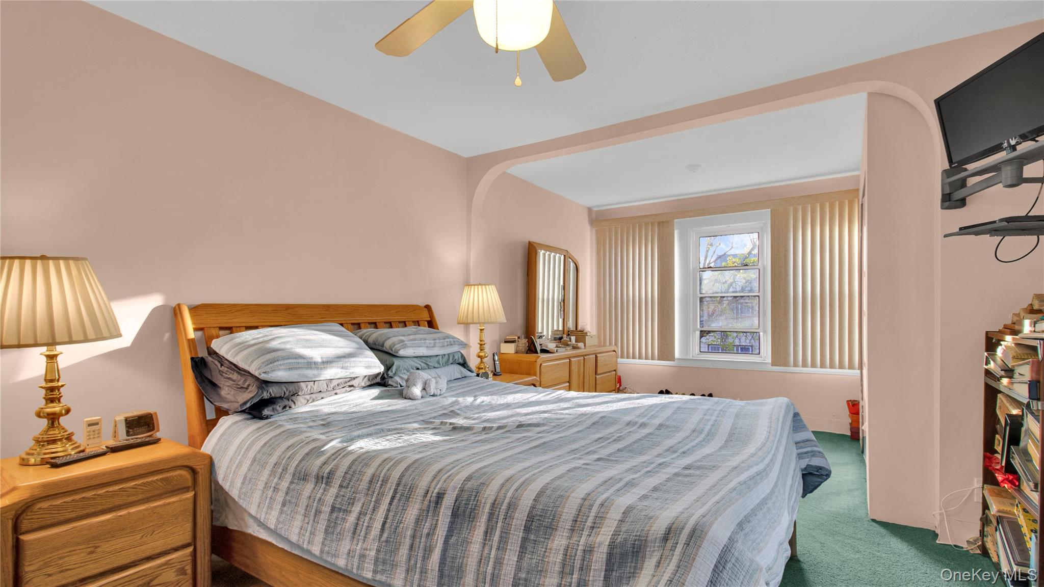 56 Liggett Road Valley Stream, NY 11581 - Photo 22 of 29 a bedroom with a bed and a flat tv screen on dresser