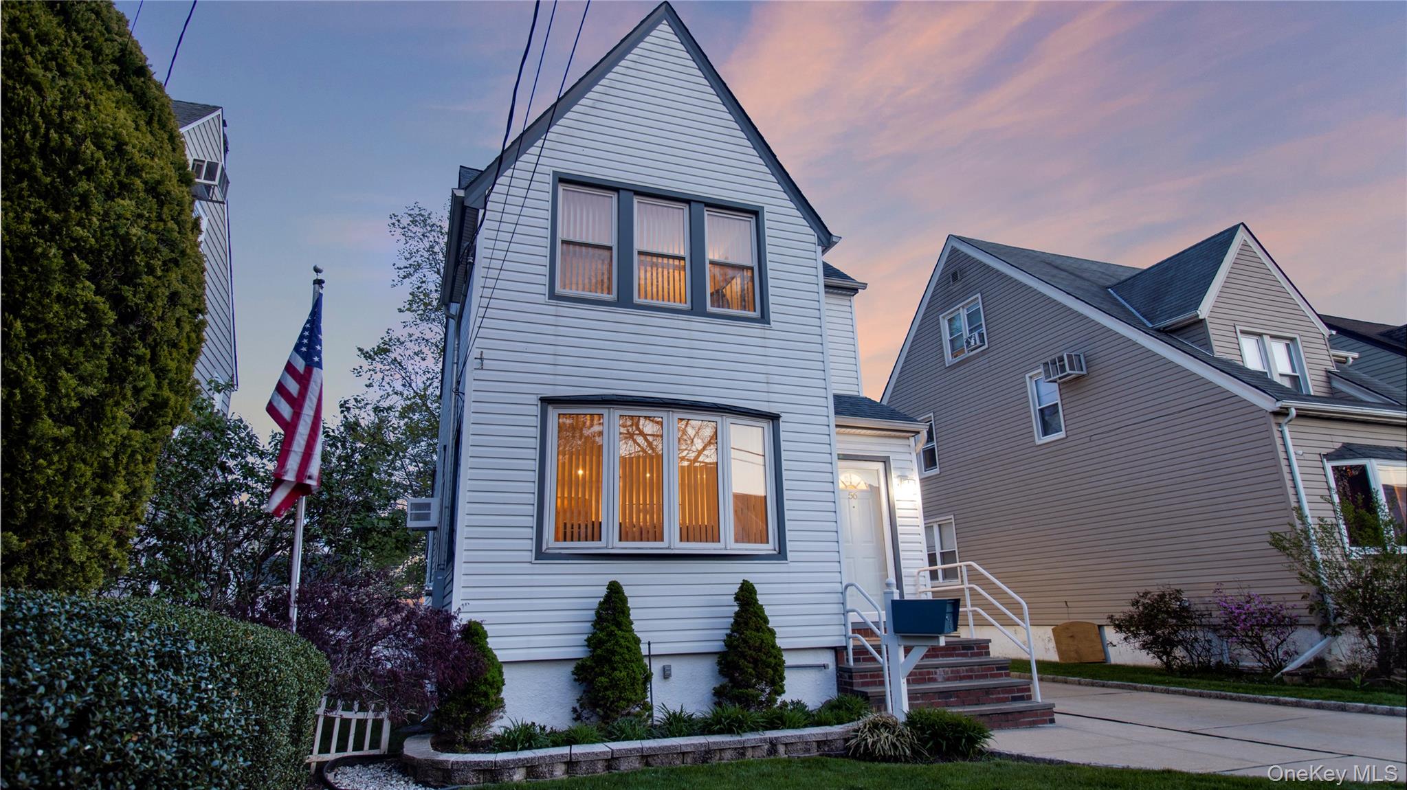 56 Liggett Road Valley Stream, NY 11581 - Photo 3 of 29 a front view of a house with plants