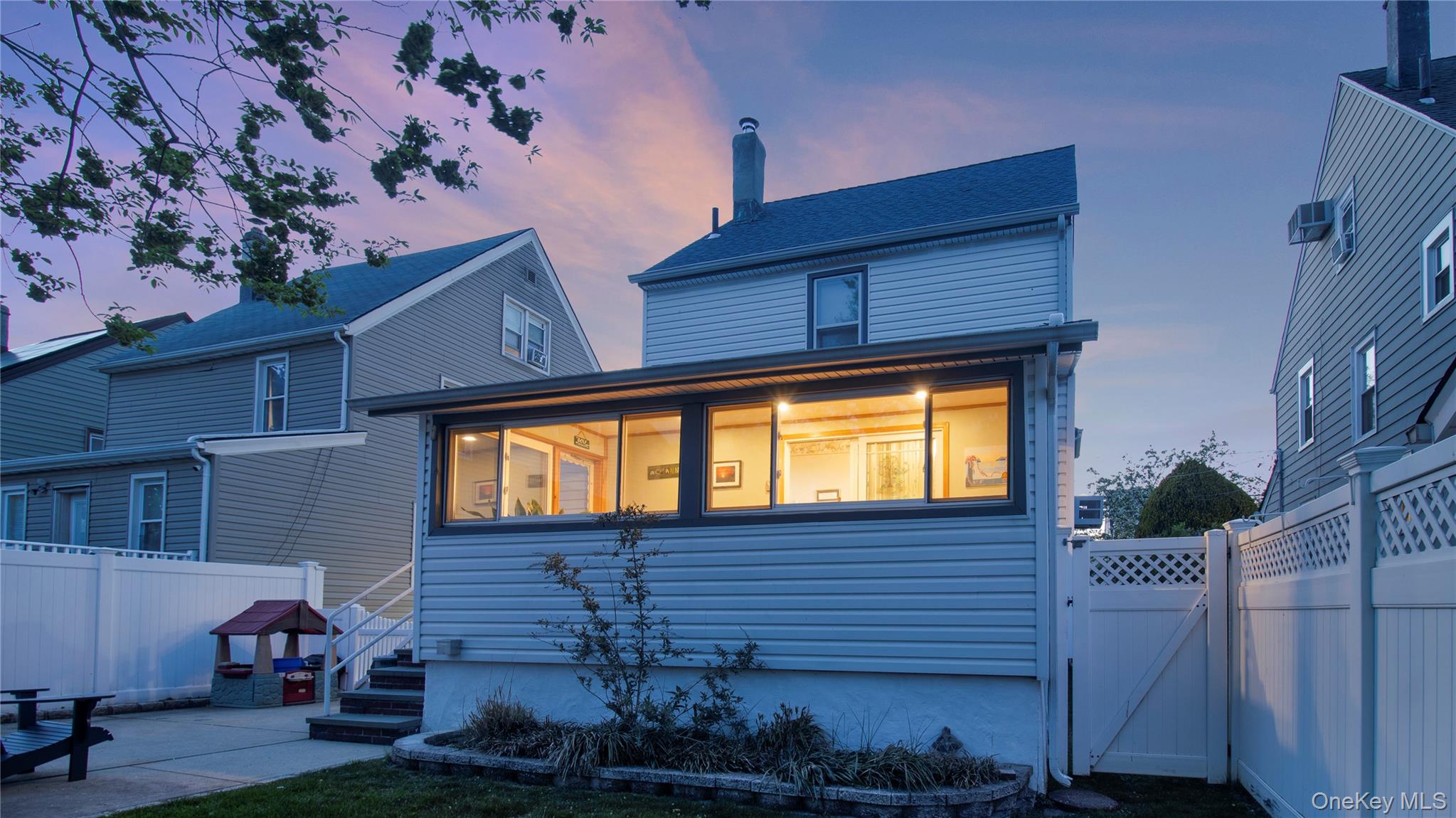 56 Liggett Road Valley Stream, NY 11581 - Photo 5 of 29 a view of a house with a small backyard