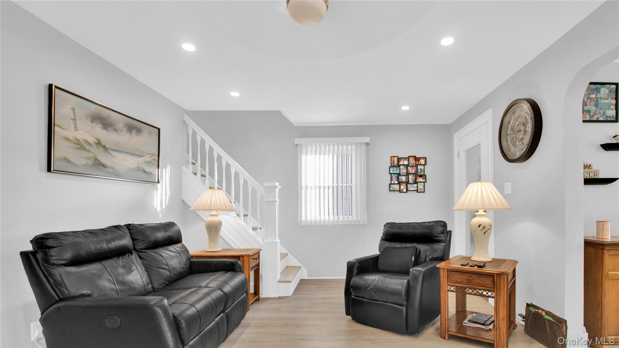 56 Liggett Road Valley Stream, NY 11581 - Photo 7 of 29 a living room with furniture and a chair
