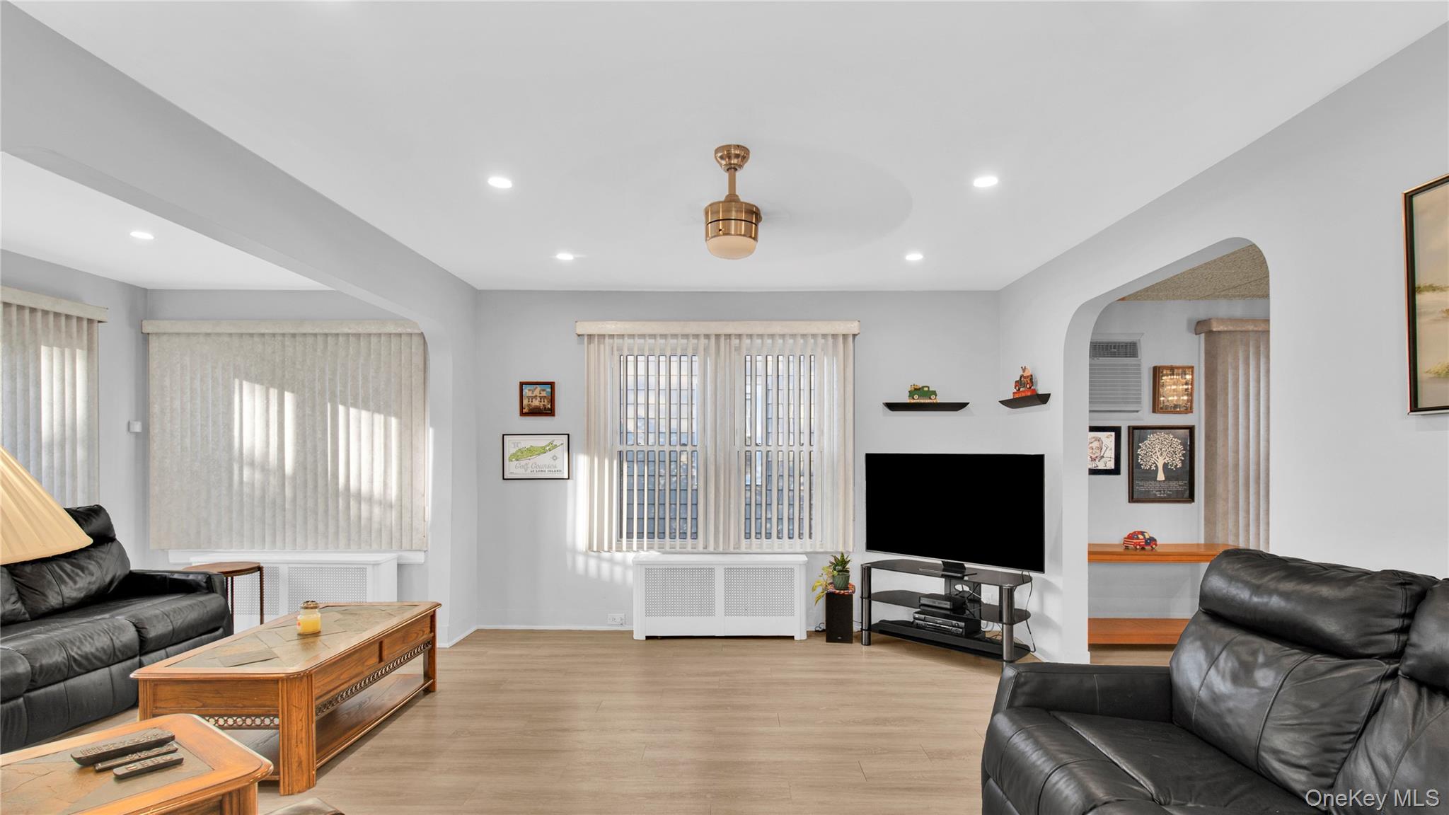 56 Liggett Road Valley Stream, NY 11581 - Photo 8 of 29 a living room with furniture and a flat screen tv