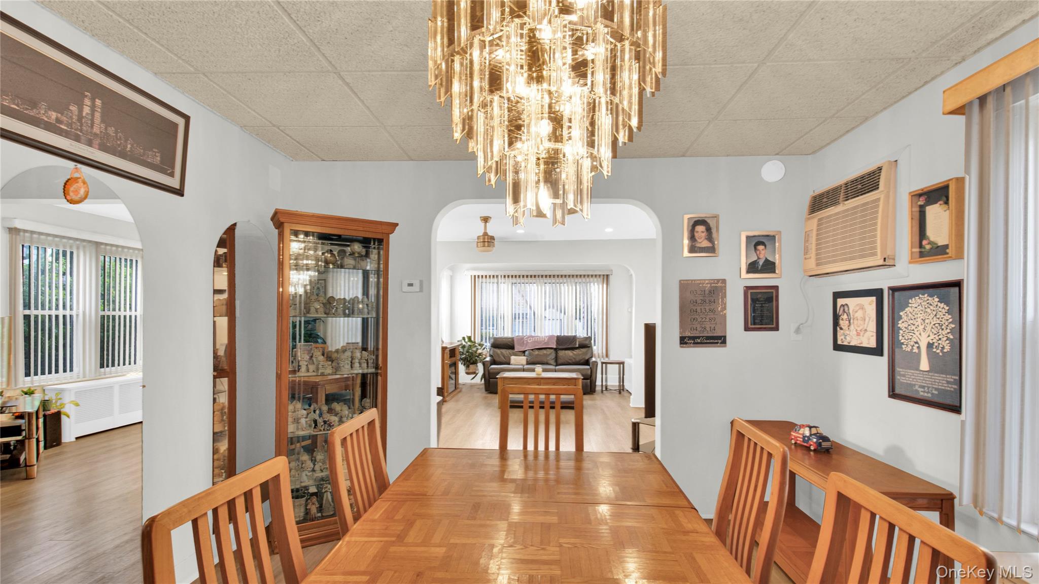 56 Liggett Road Valley Stream, NY 11581 - Photo 10 of 29 a view of a dining room with furniture wooden floor and chandelier