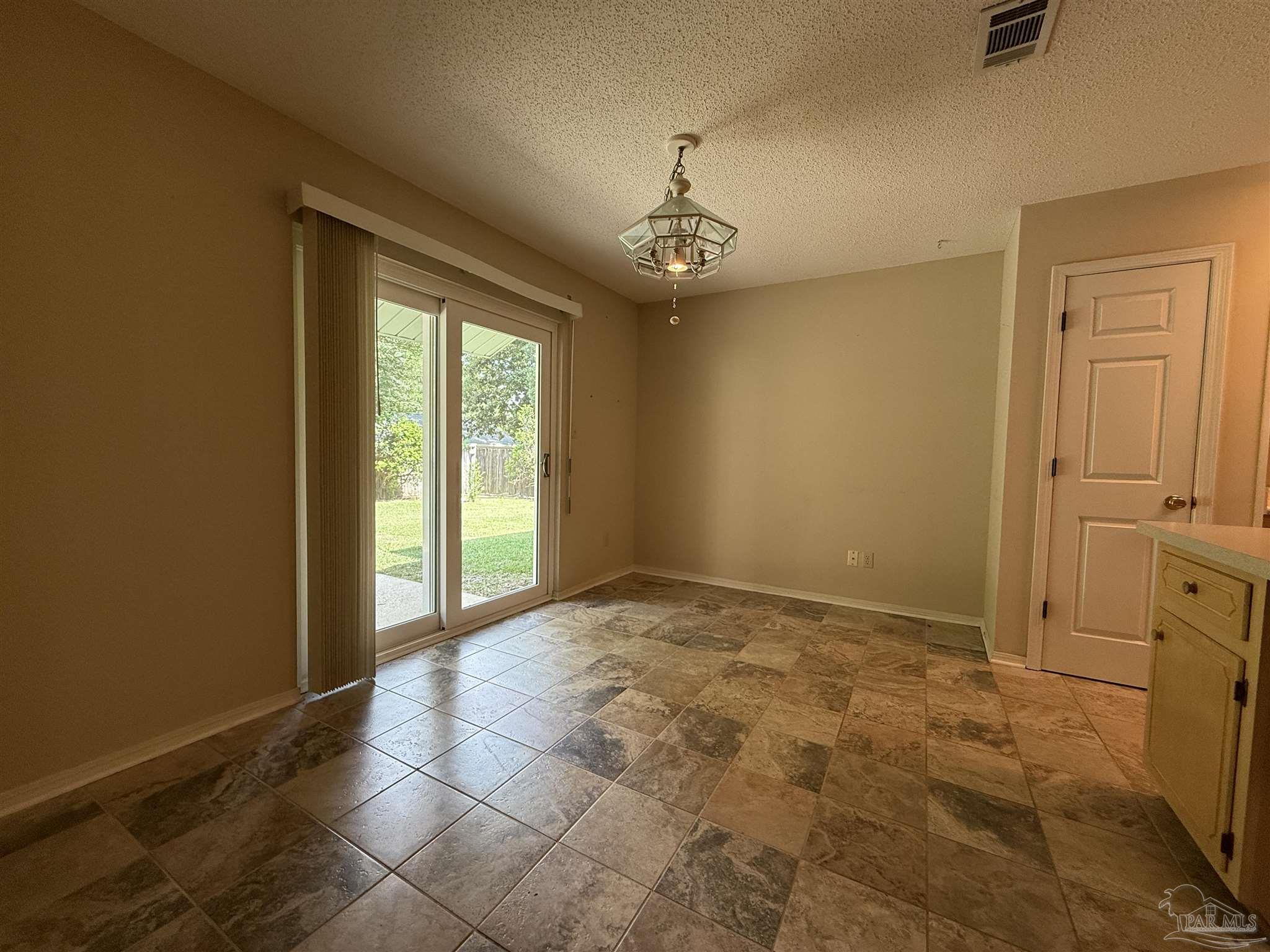 4814 Autumn Drive Pace, FL 32571 - Photo 12 of 52 a view of an empty room with a window