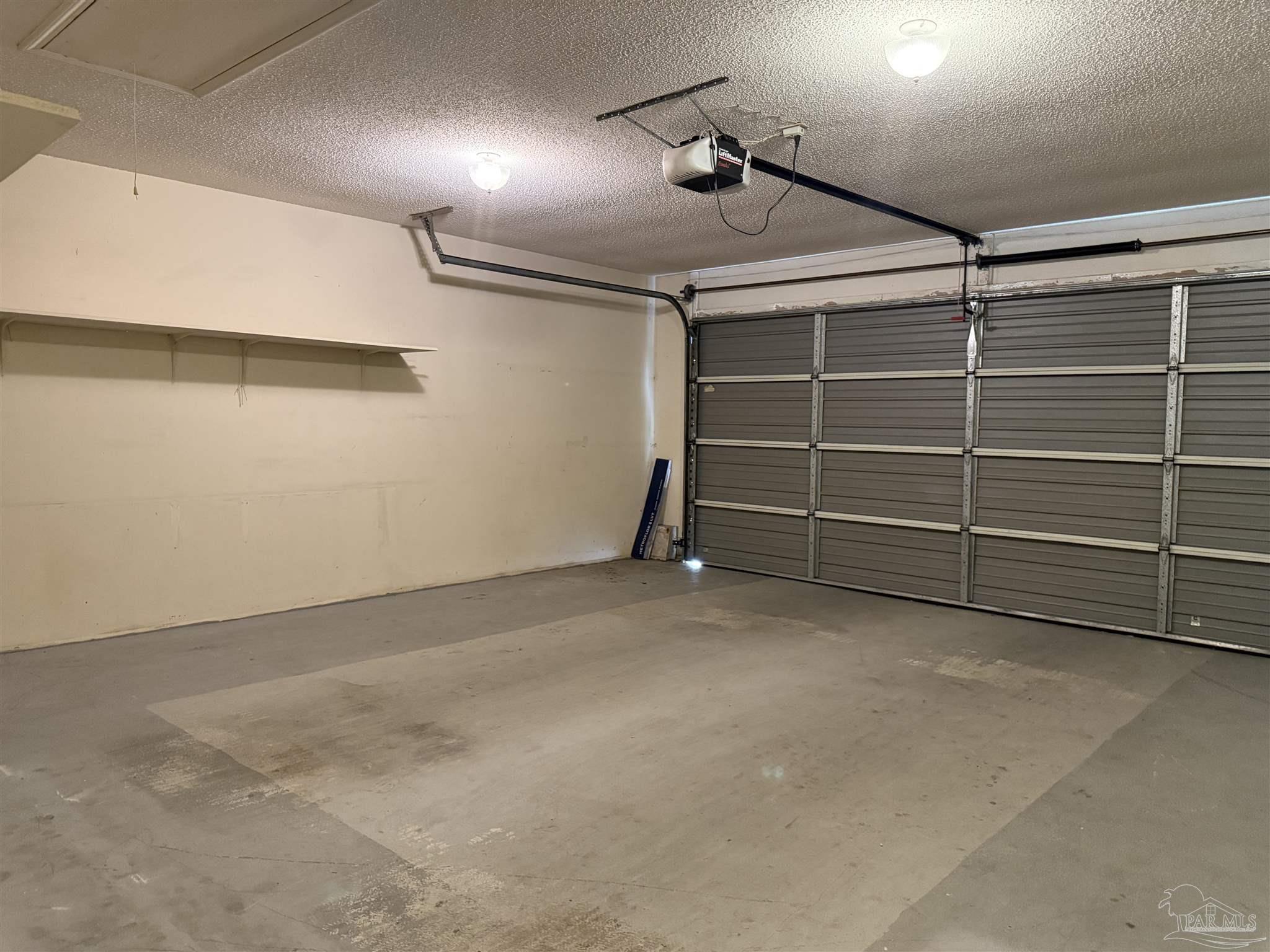 4814 Autumn Drive Pace, FL 32571 - Photo 18 of 52 a view of an empty room with shelves
