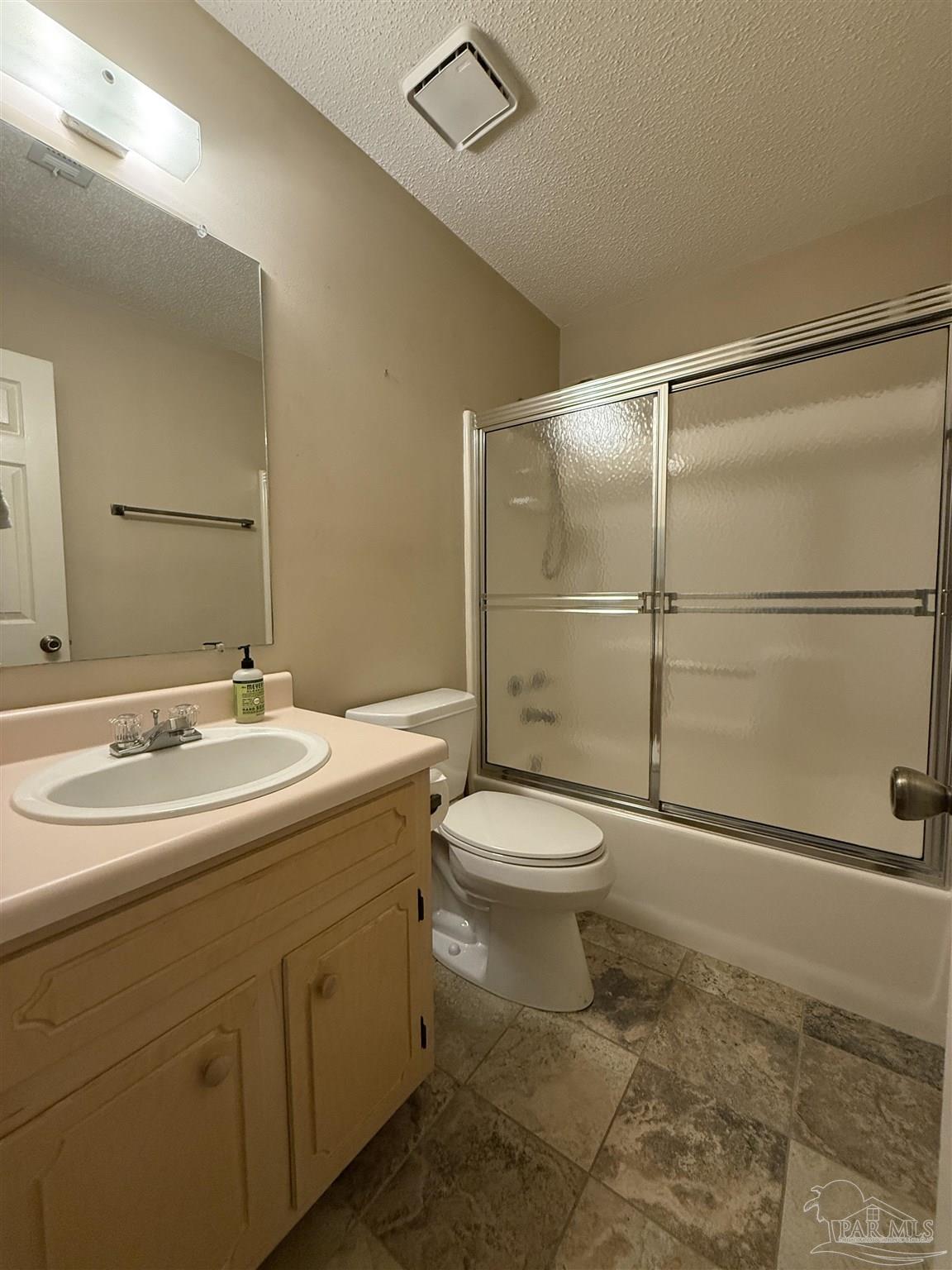 4814 Autumn Drive Pace, FL 32571 - Photo 26 of 52 a bathroom with a toilet sink and a shower
