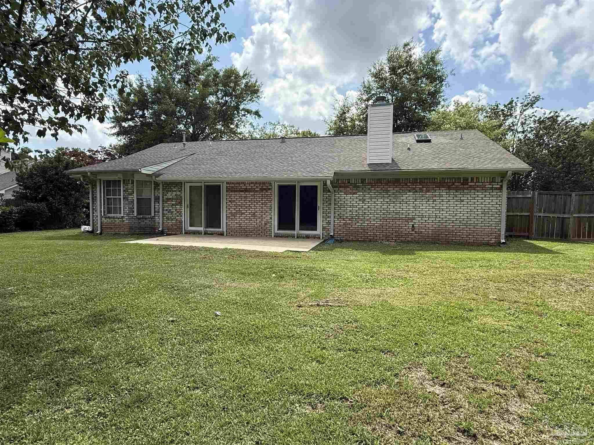 4814 Autumn Drive Pace, FL 32571 - Photo 3 of 52 a front view of house with yard and trees