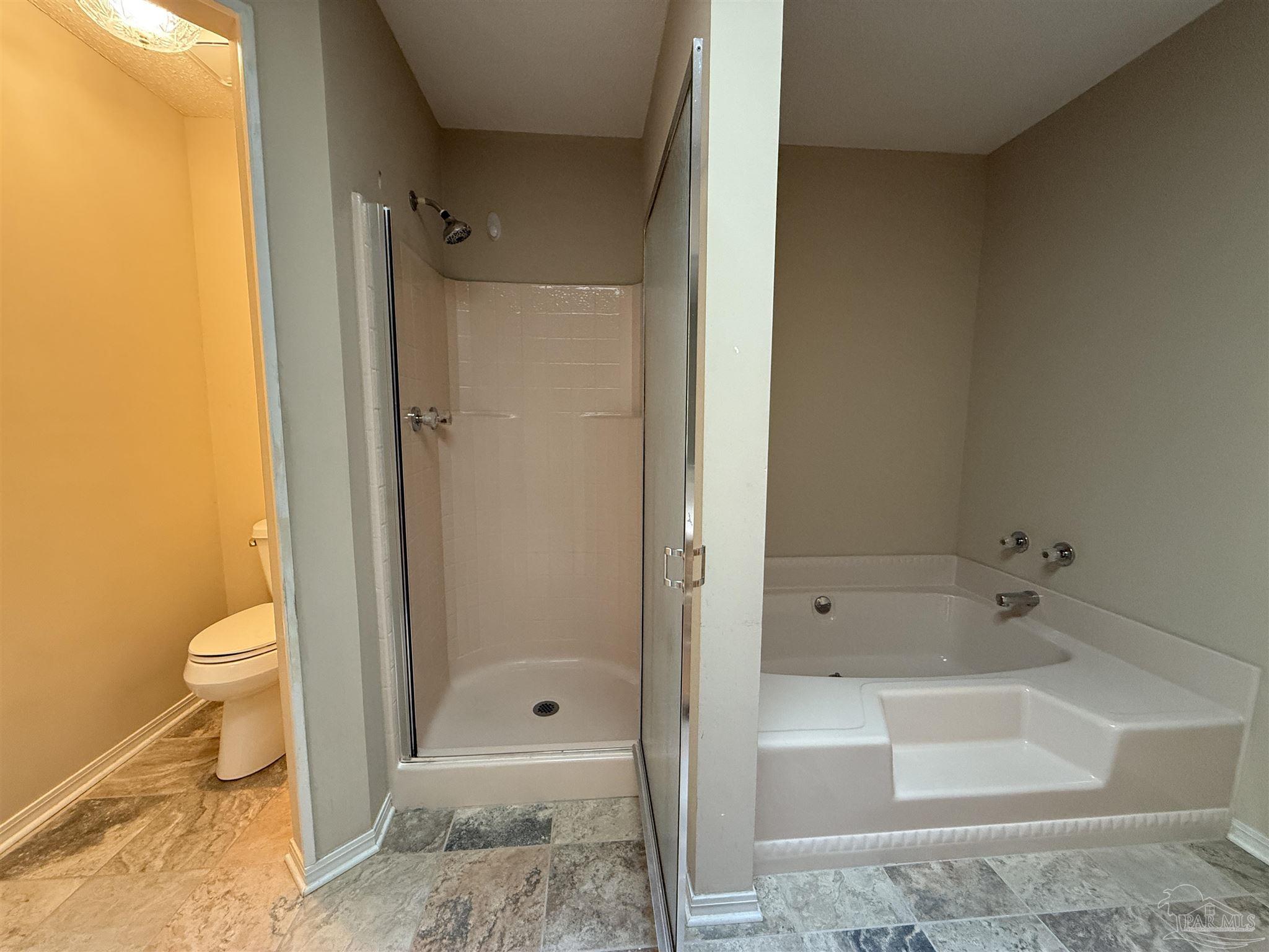 4814 Autumn Drive Pace, FL 32571 - Photo 35 of 52 a bathroom with a granite countertop toilet and shower