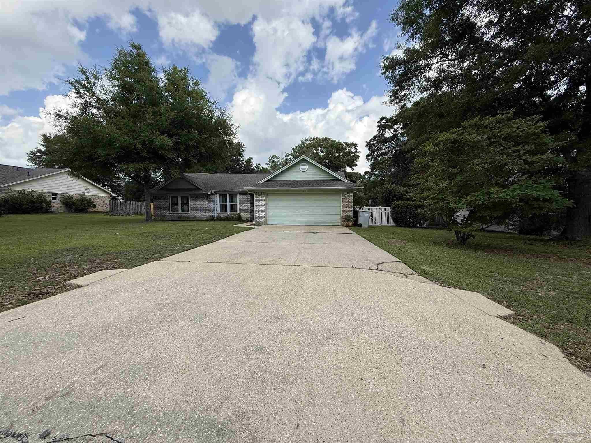 4814 Autumn Drive Pace, FL 32571 - Photo 44 of 52 a house with trees in the background