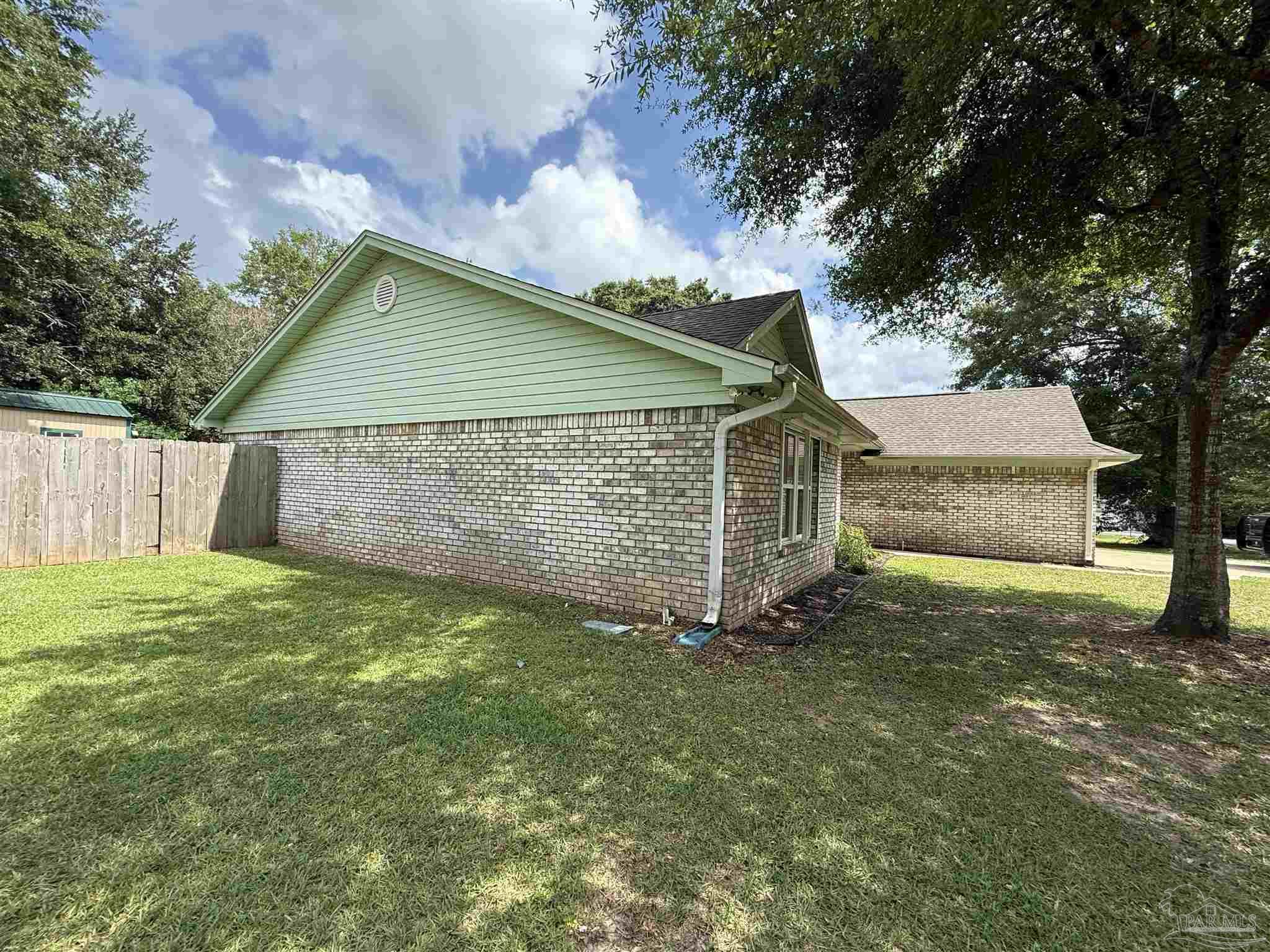 4814 Autumn Drive Pace, FL 32571 - Photo 46 of 52 a view of a back yard of the house