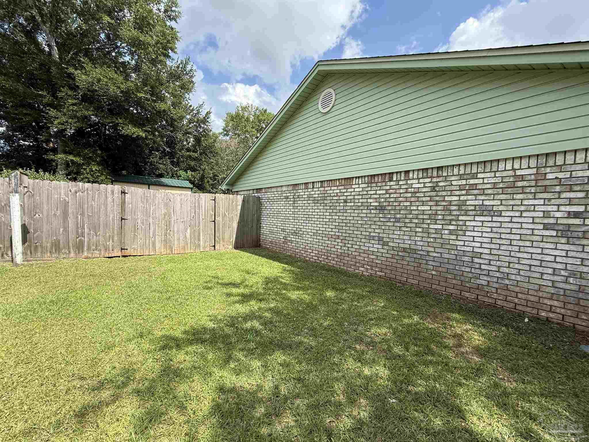 4814 Autumn Drive Pace, FL 32571 - Photo 47 of 52 a backyard of a house