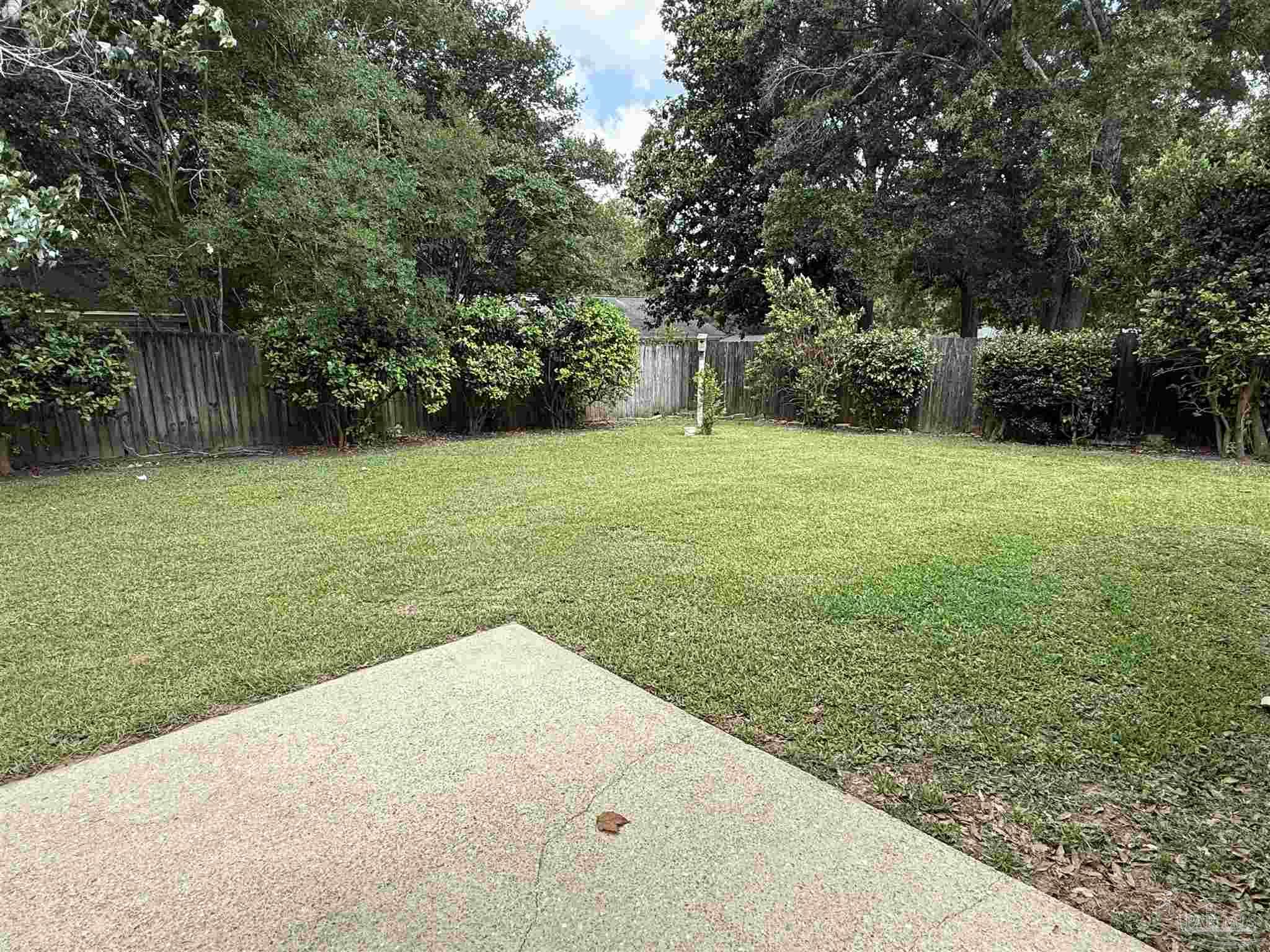 4814 Autumn Drive Pace, FL 32571 - Photo 49 of 52 a view of a yard with a trees