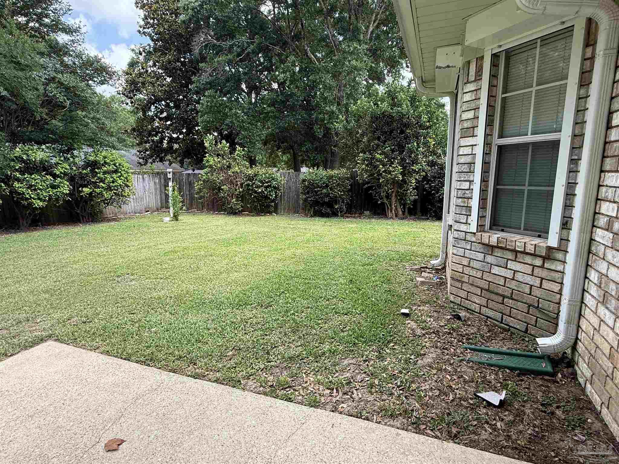 4814 Autumn Drive Pace, FL 32571 - Photo 50 of 52 a view of a backyard with large trees