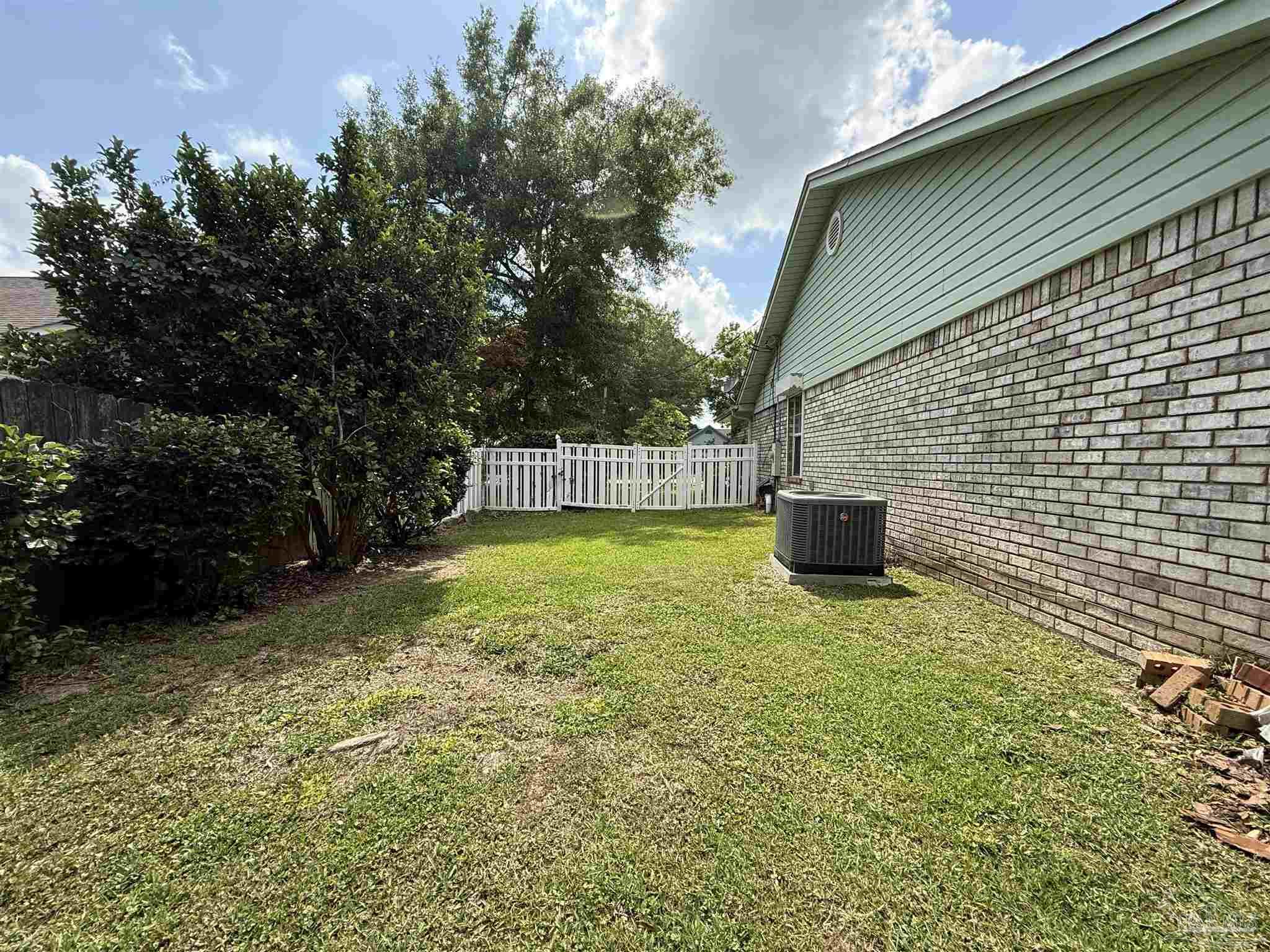4814 Autumn Drive Pace, FL 32571 - Photo 51 of 52 a backyard of a house with lots of green space