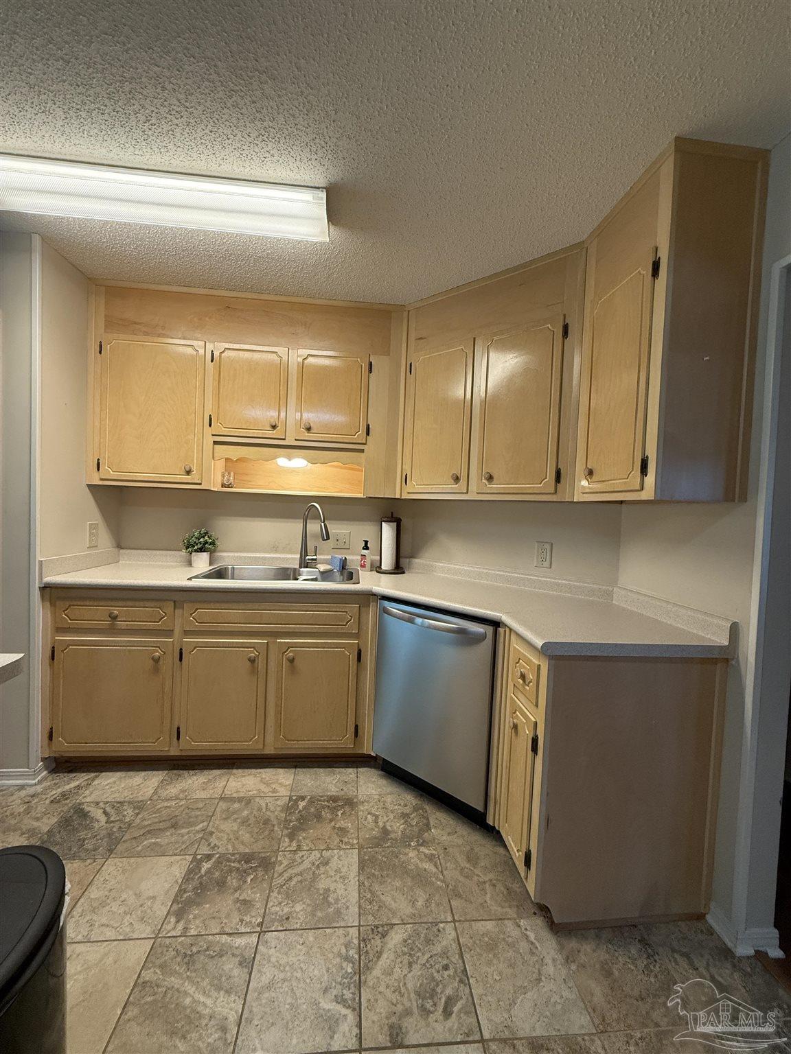 4814 Autumn Drive Pace, FL 32571 - Photo 8 of 52 a kitchen with a sink cabinets and window
