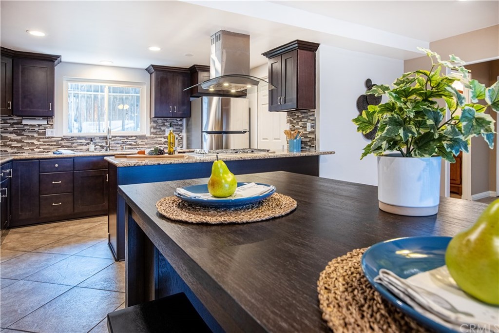 1408 Las Lomas Drive Brea, CA 92821 - Photo 19 of 47 a kitchen with stainless steel appliances granite countertop a sink dishwasher a refrigerator and a stove