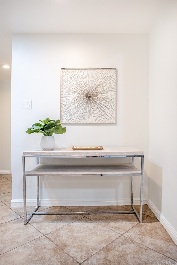 1408 Las Lomas Drive Brea, CA 92821 - Photo 5 of 47 a white cabinet with a potted plant on it
