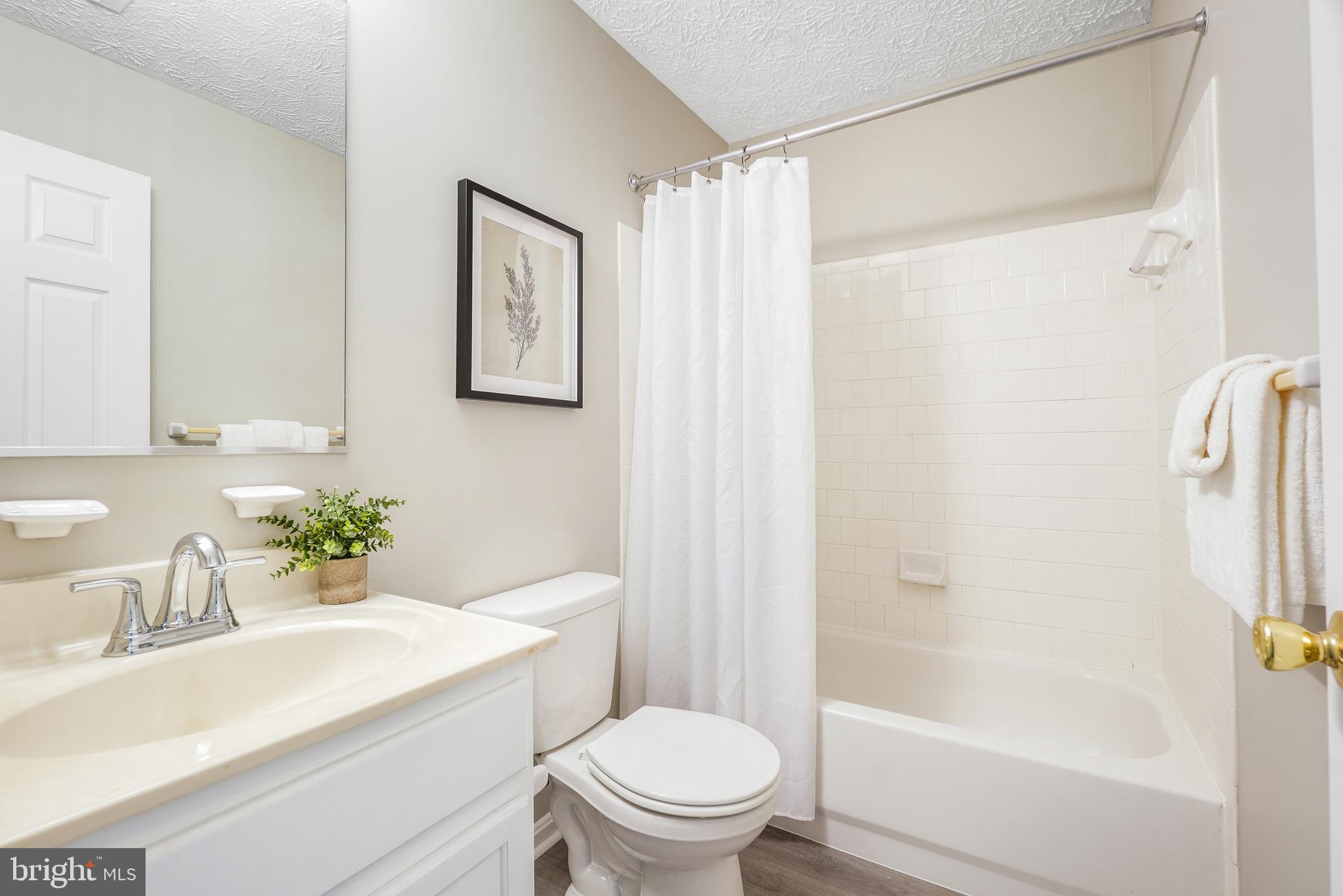 10 Ironstone Court, Unit E Annapolis, MD 21403 - Photo 15 of 24 a bathroom with a sink a toilet and shower