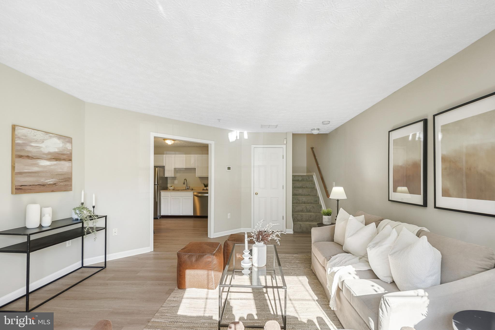 10 Ironstone Court, Unit E Annapolis, MD 21403 - Photo 4 of 24 a living room with furniture and a wooden floor