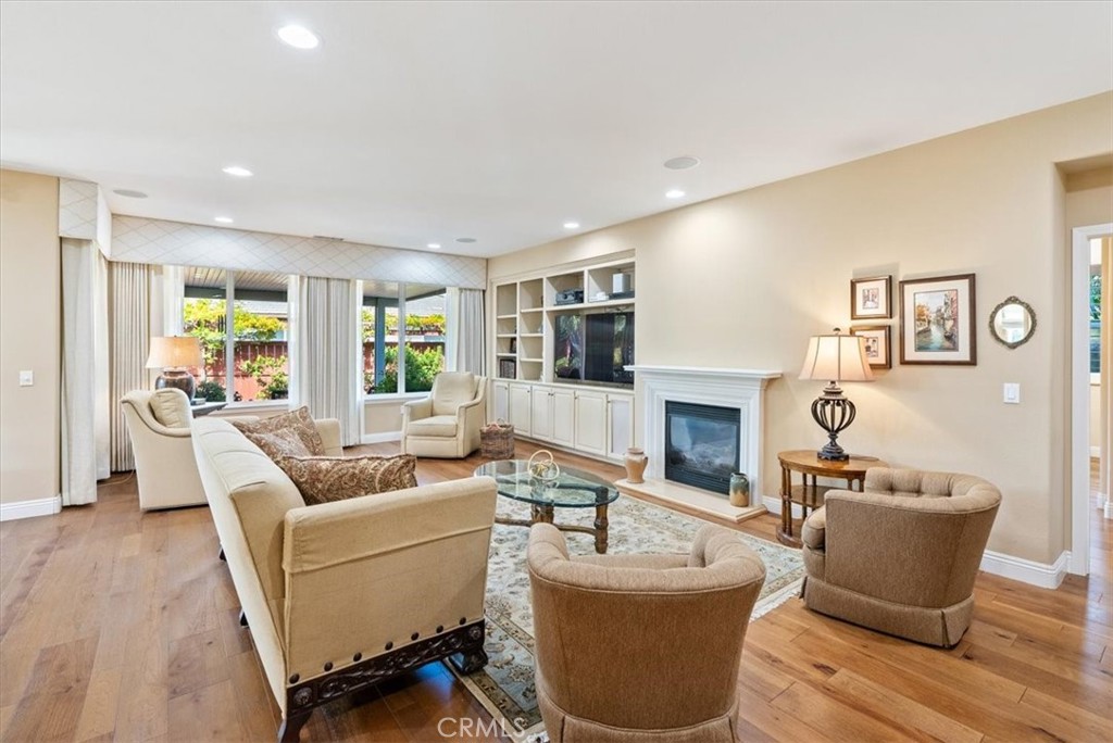 2425 Traditions Loop Paso Robles, CA 93446 - Photo 11 of 34 a living room with furniture a fireplace and a large window