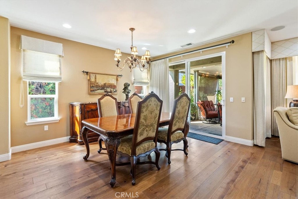 2425 Traditions Loop Paso Robles, CA 93446 - Photo 15 of 34 a view of a dining room with furniture window and wooden floor