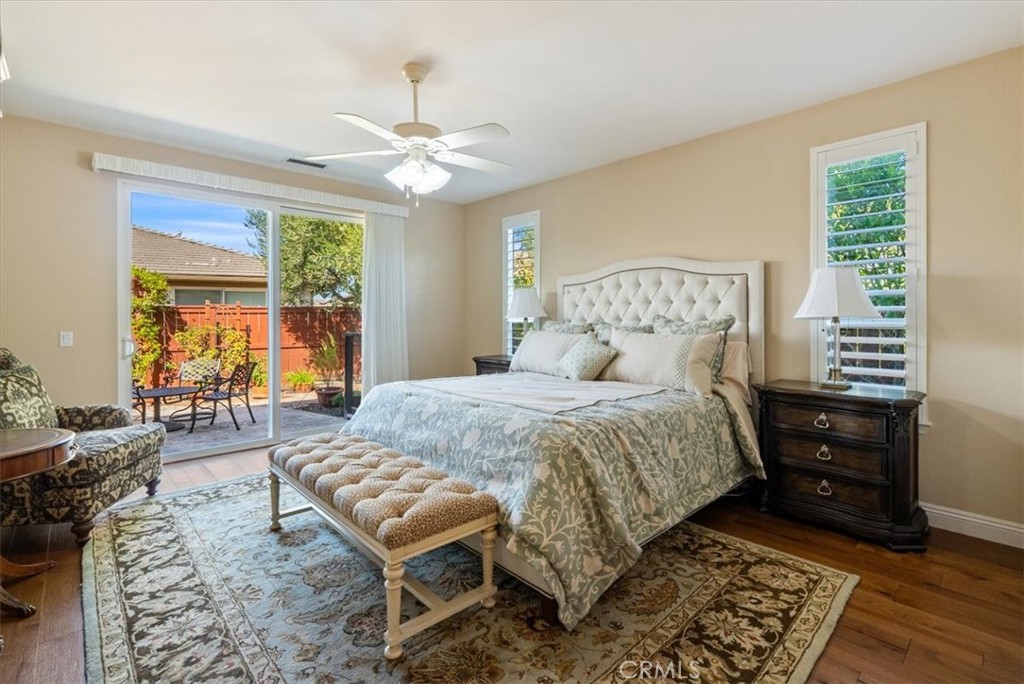 2425 Traditions Loop Paso Robles, CA 93446 - Photo 16 of 34 a bedroom with a bed and wooden floor