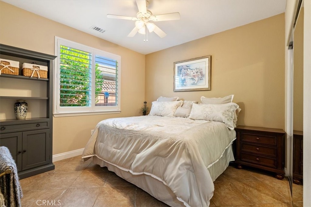 2425 Traditions Loop Paso Robles, CA 93446 - Photo 24 of 34 a bedroom with a bed and a window