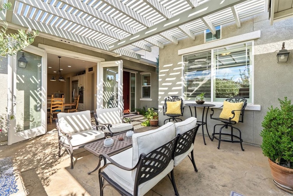 2425 Traditions Loop Paso Robles, CA 93446 - Photo 26 of 34 a building outdoor space with patio furniture and potted plants