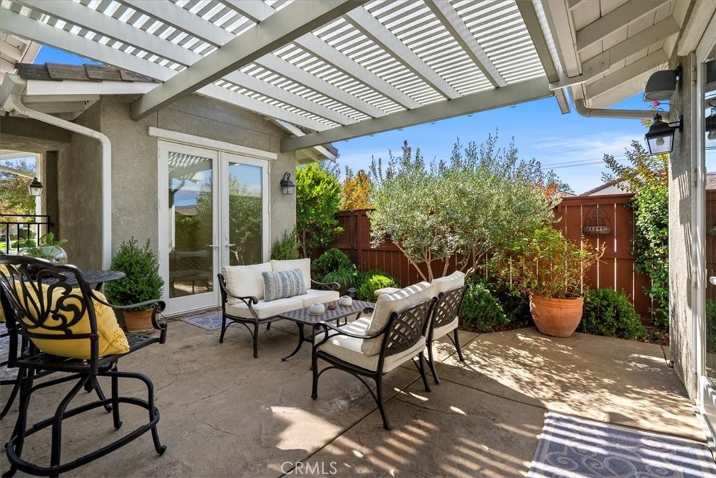 2425 Traditions Loop Paso Robles, CA 93446 - Photo 28 of 34 a building outdoor space with patio furniture and potted plants