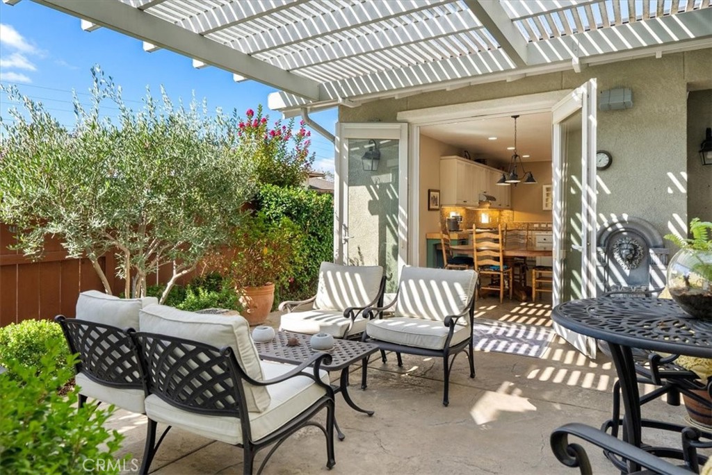 2425 Traditions Loop Paso Robles, CA 93446 - Photo 3 of 34 a view of an outdoor dining space with a table and chairs