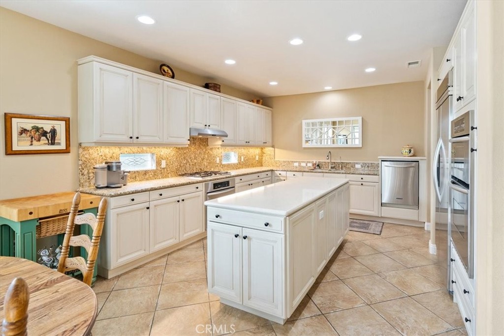 2425 Traditions Loop Paso Robles, CA 93446 - Photo 7 of 34 a kitchen with a sink window and cabinets