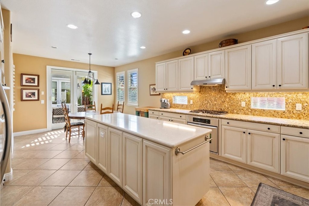 2425 Traditions Loop Paso Robles, CA 93446 - Photo 8 of 34 a kitchen with a sink window and cabinets