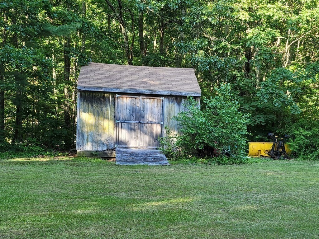 91 Lower Gore Road Webster, MA 01570 - Photo 32 of 37 a view of a backyard with a garden