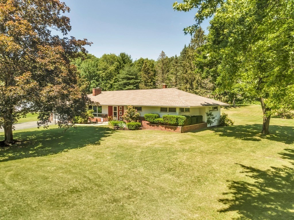 91 Lower Gore Road Webster, MA 01570 - Photo 4 of 37 a backyard of a house with yard and outdoor seating