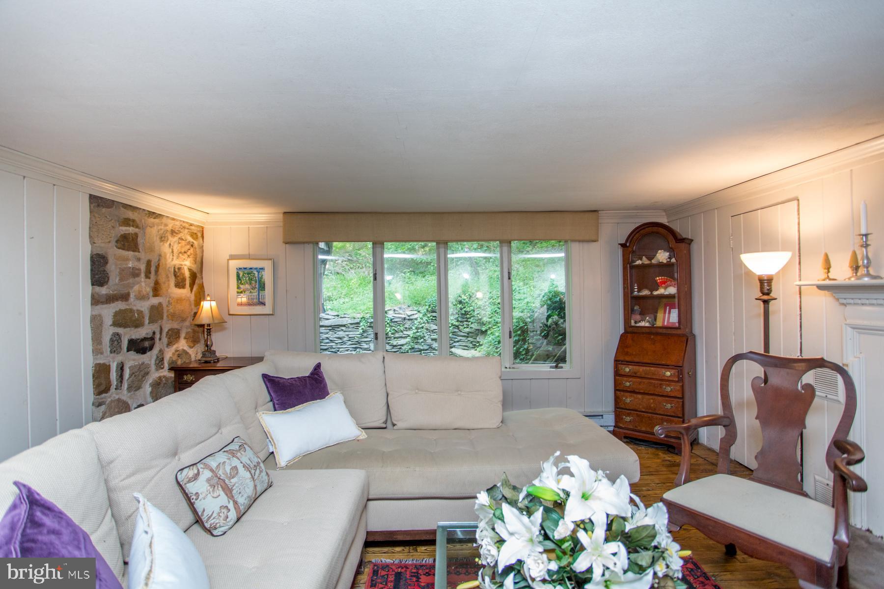 5131 Toll Gate Road Pipersville, PA 18947 - Photo 23 of 53 Living room partial stone wall